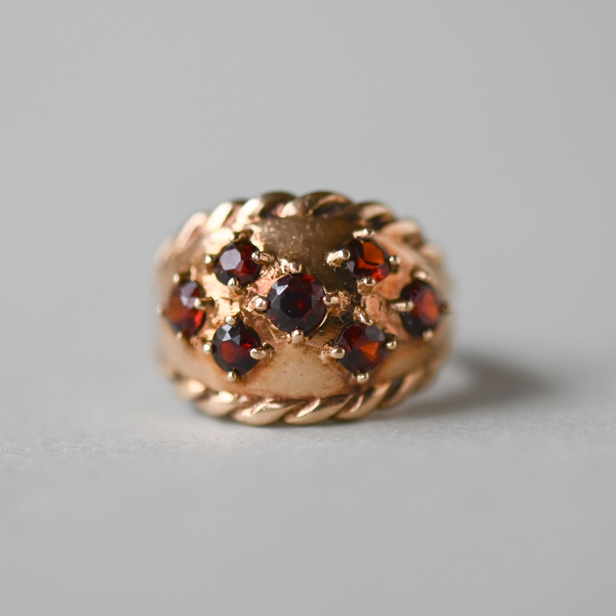 Aesthetic 9ct gold garnet bombe ring, c.1960s