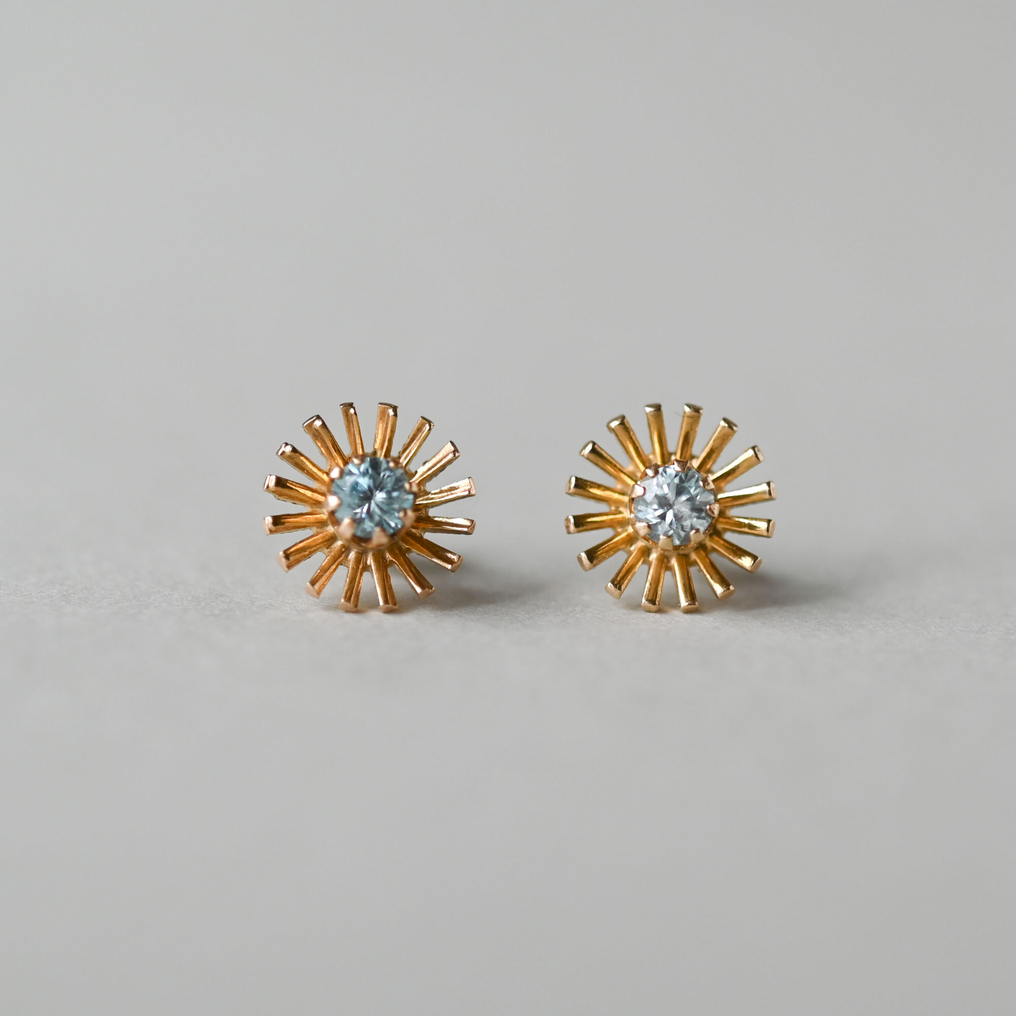 Vintage pair of 9ct gold sun beam blue topaz earrings