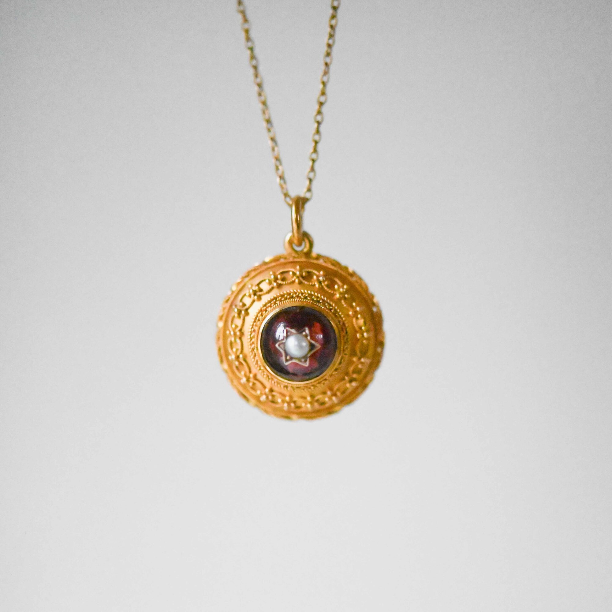 Antique Etrsucan Revival 18ct gold garnet and pearl starburst pendant with locket c.1880s