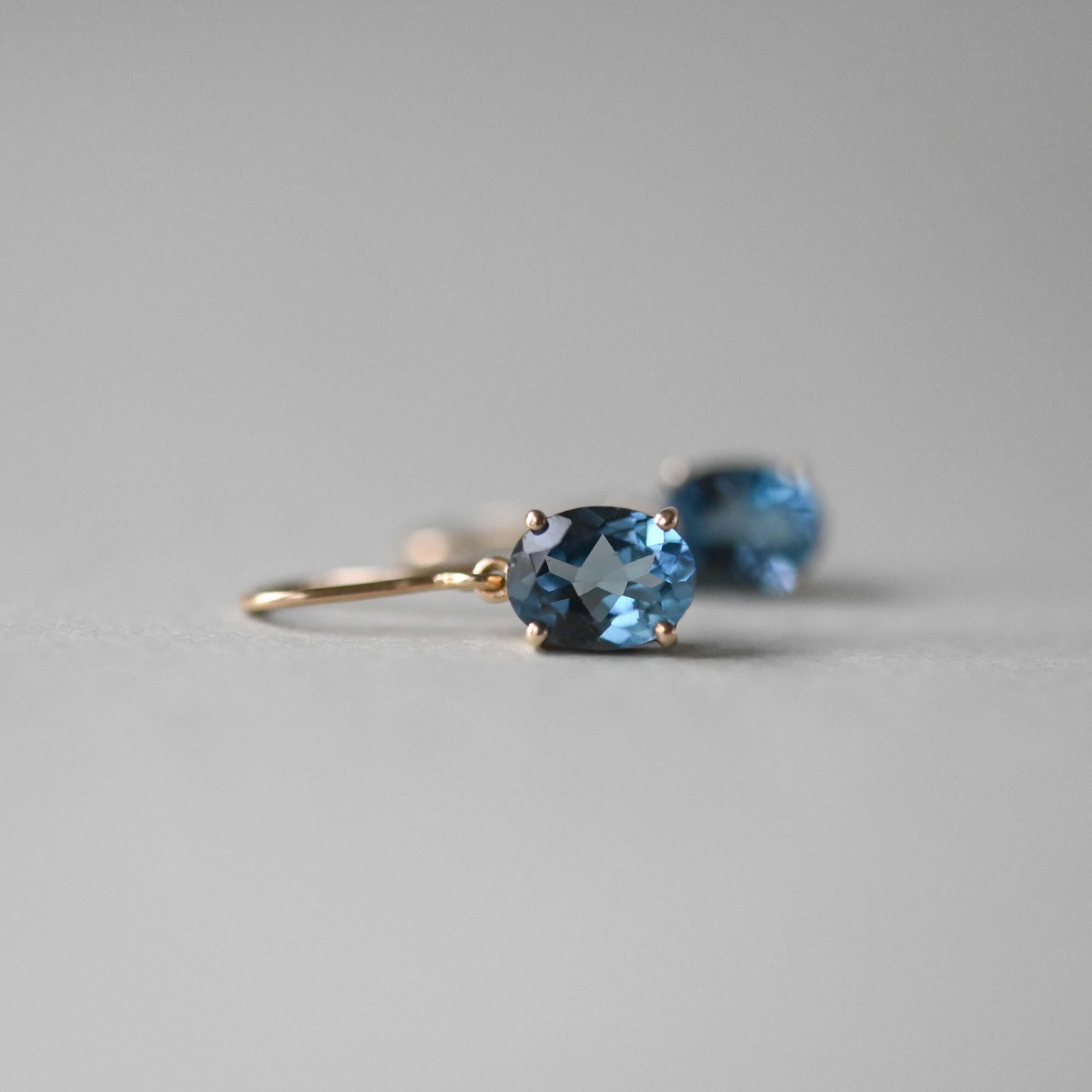 Contemporary pair of 9ct gold blue topaz earrings