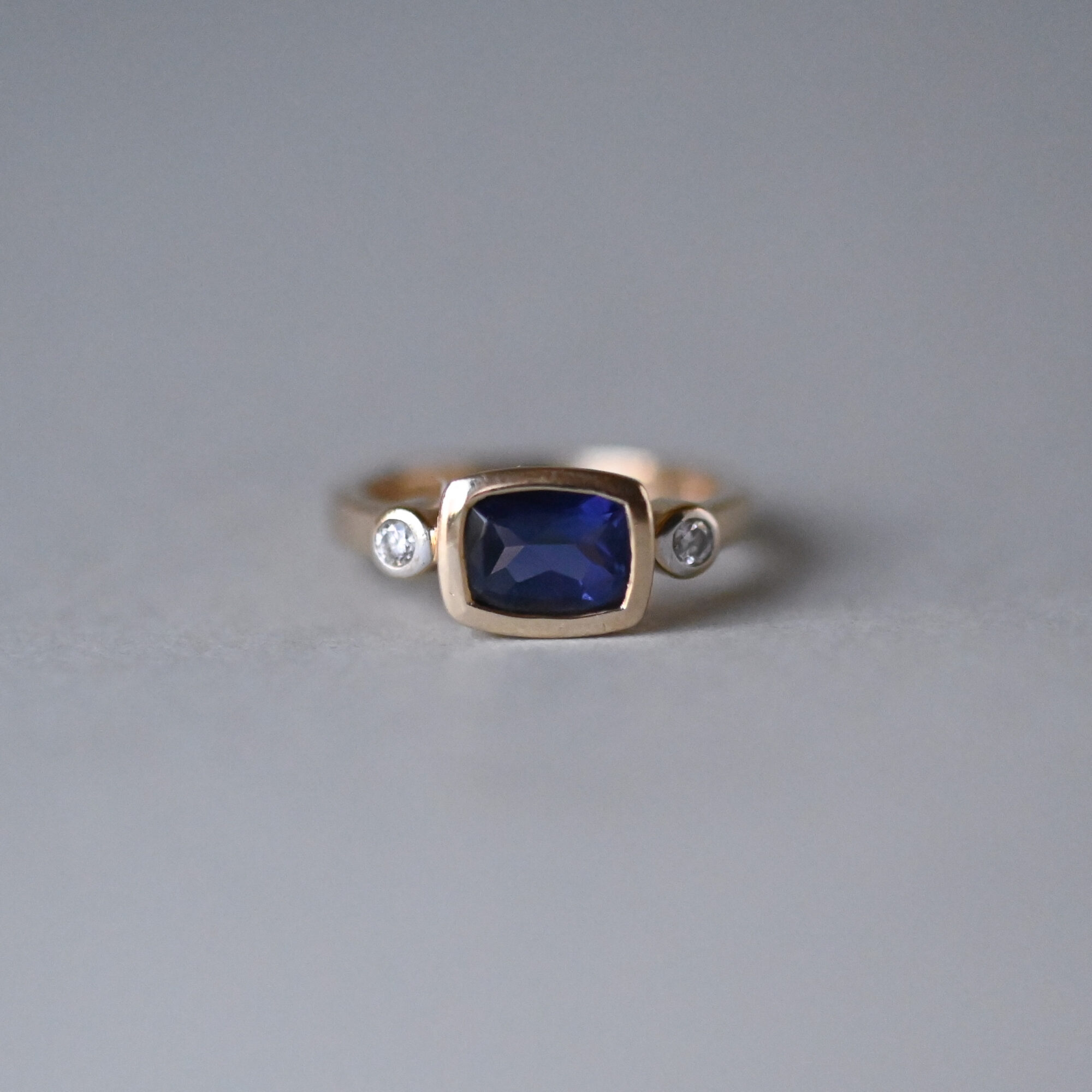 Contemporary 14ct gold violet blue iolite and diamond three stone ring