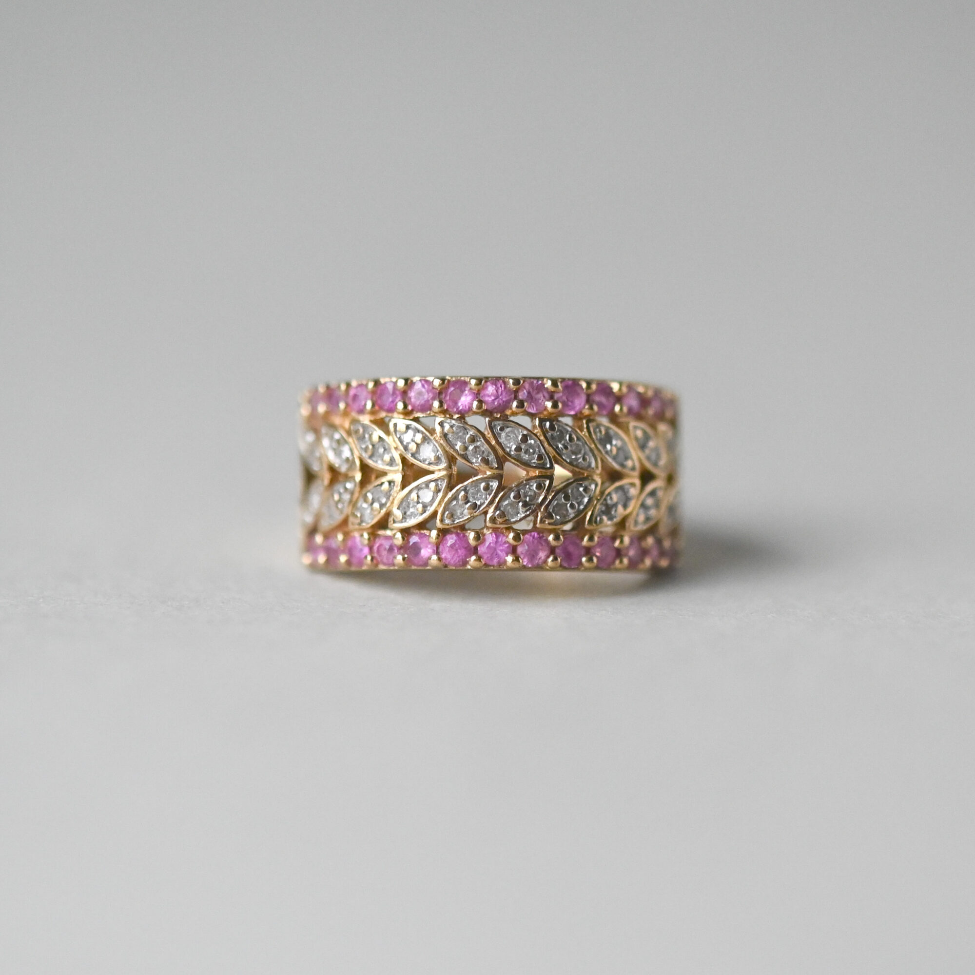 Contemporary 9ct gold pink sapphire and diamond leaf ring