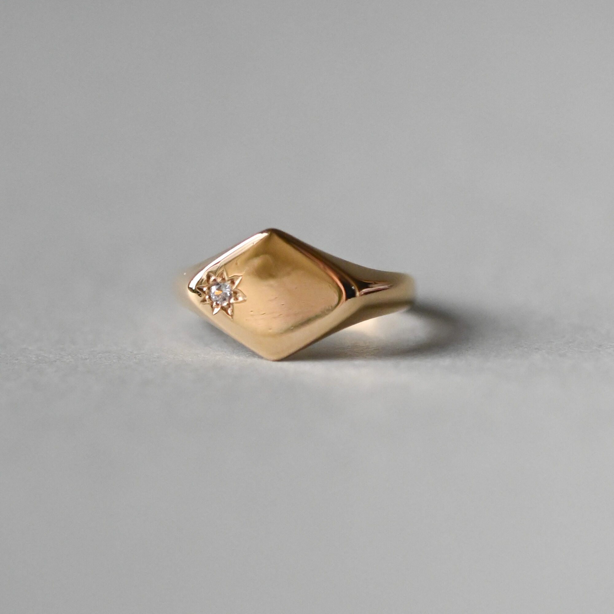 Aesthetic 18ct gold diamond starburst lozenge signet ring