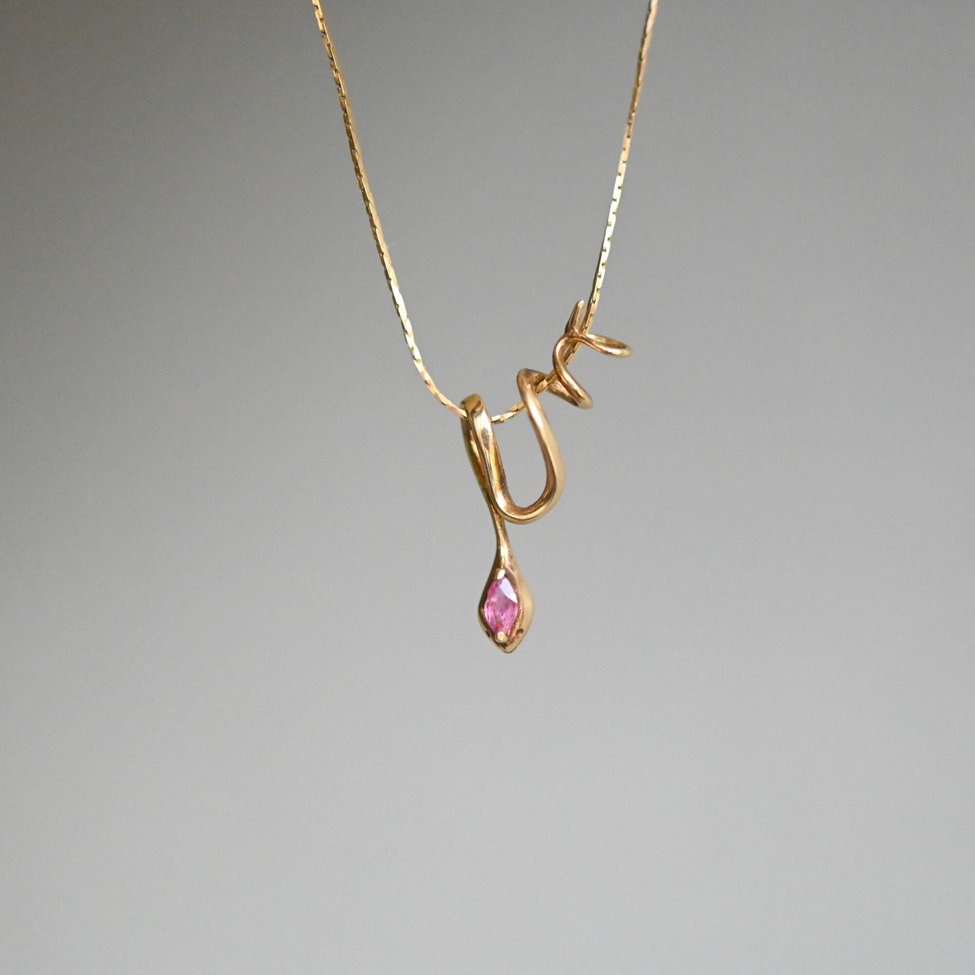 Contemporary 14ct gold orange sapphire slider snake necklace