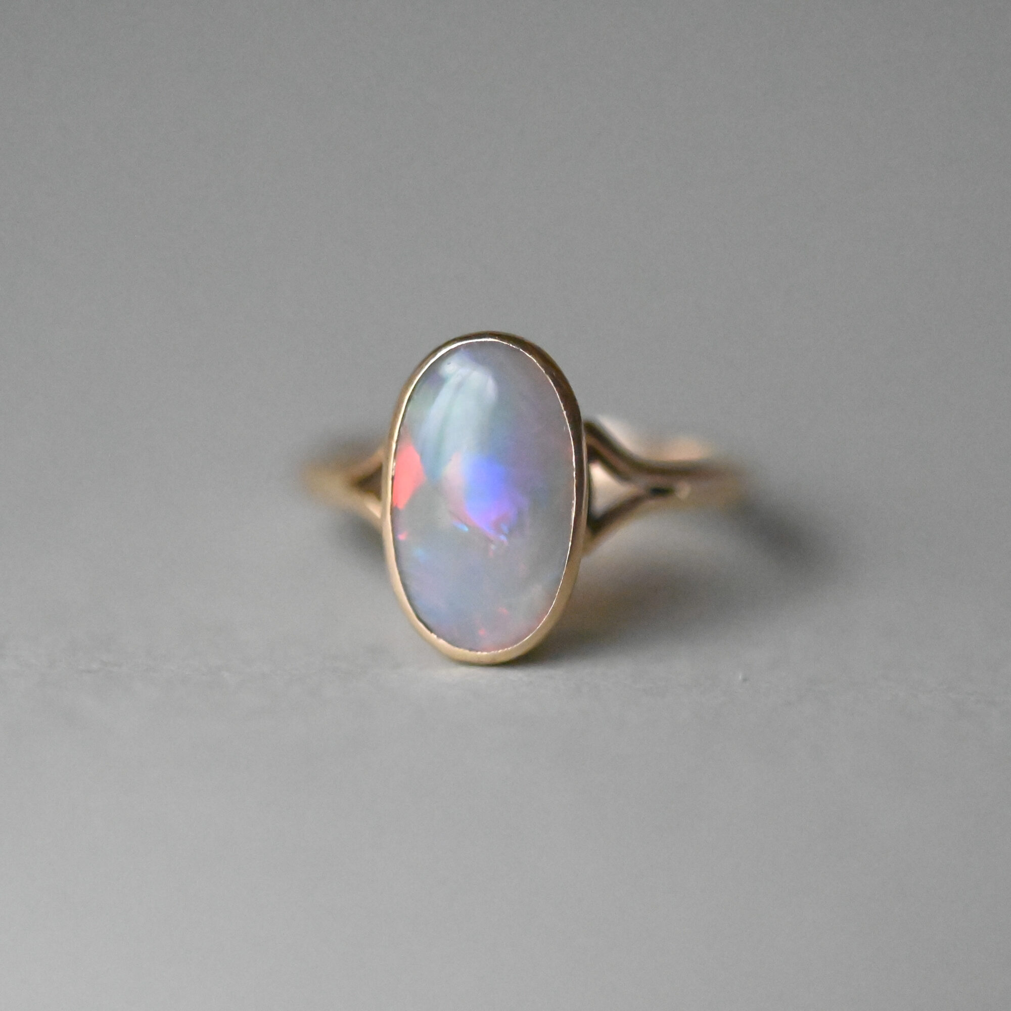 Art Deco 9ct gold fiery opal solitaire ring, c.1920s