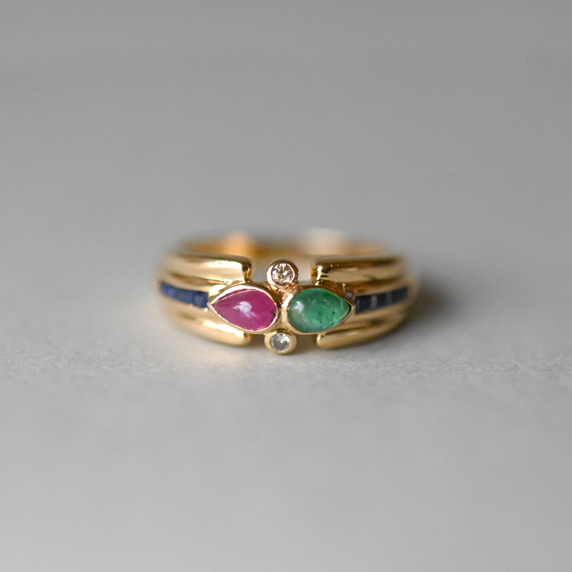 Contemporary 18ct gold emerald, sapphire, ruby and diamond aesthetic ring