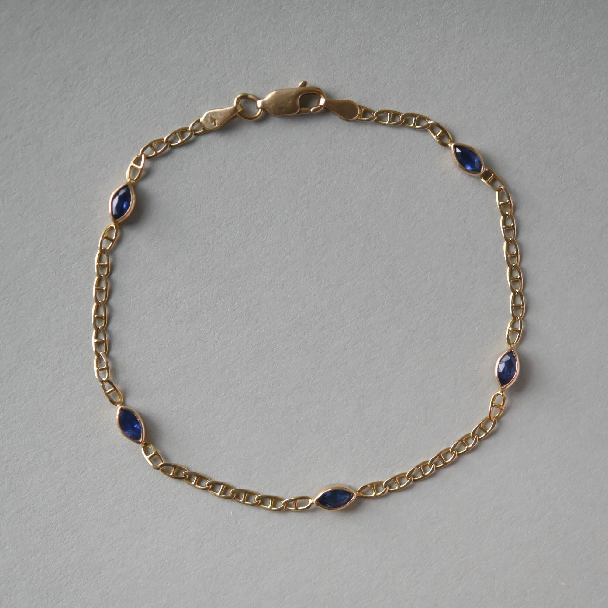 Contemporary 18ct gold marquise sapphire mariner link bracelet