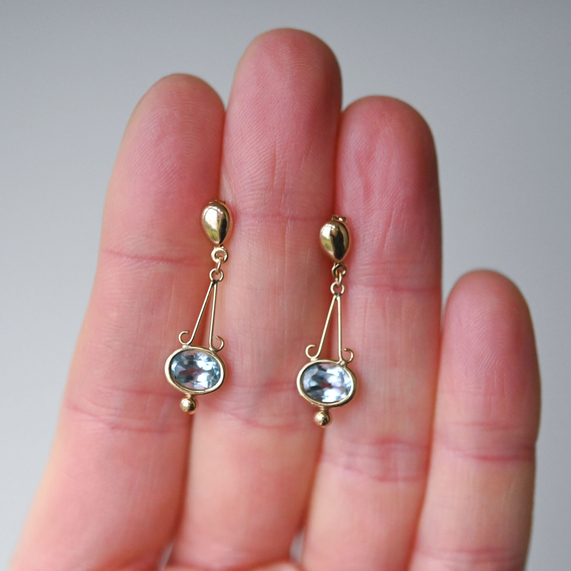 Contemporary pair of 9ct gold blue topaz Greek Goddess drop earrings - Image 3