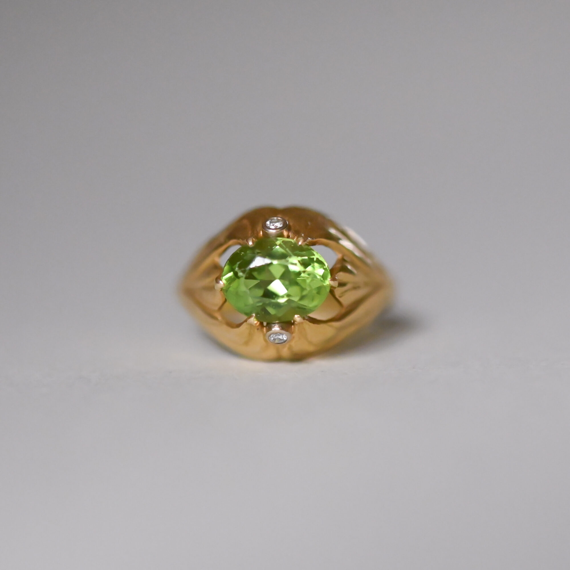 Ethereal 18ct gold peridot and diamond leaf ring