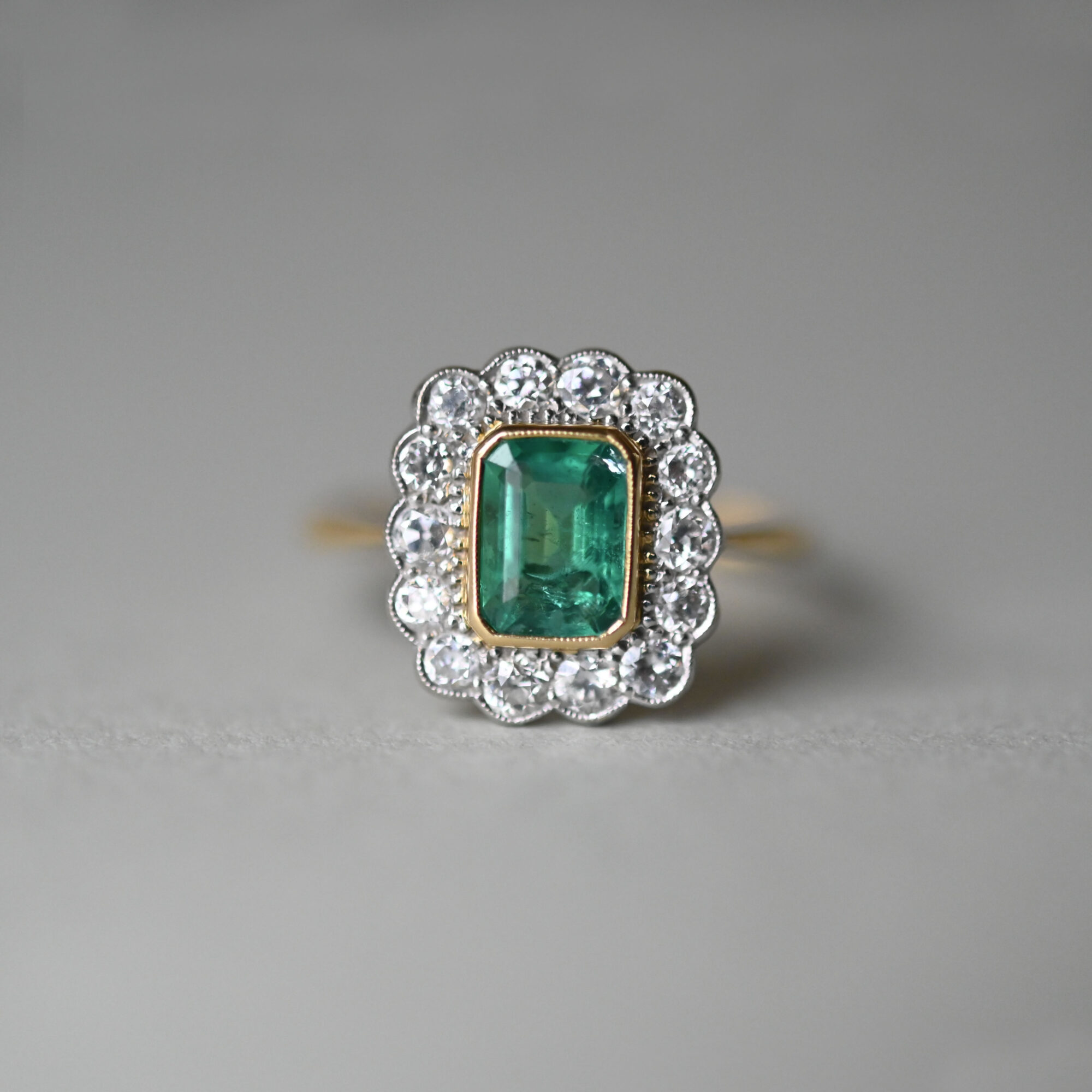 Exceptional 18ct gold emerald and diamond cluster ring