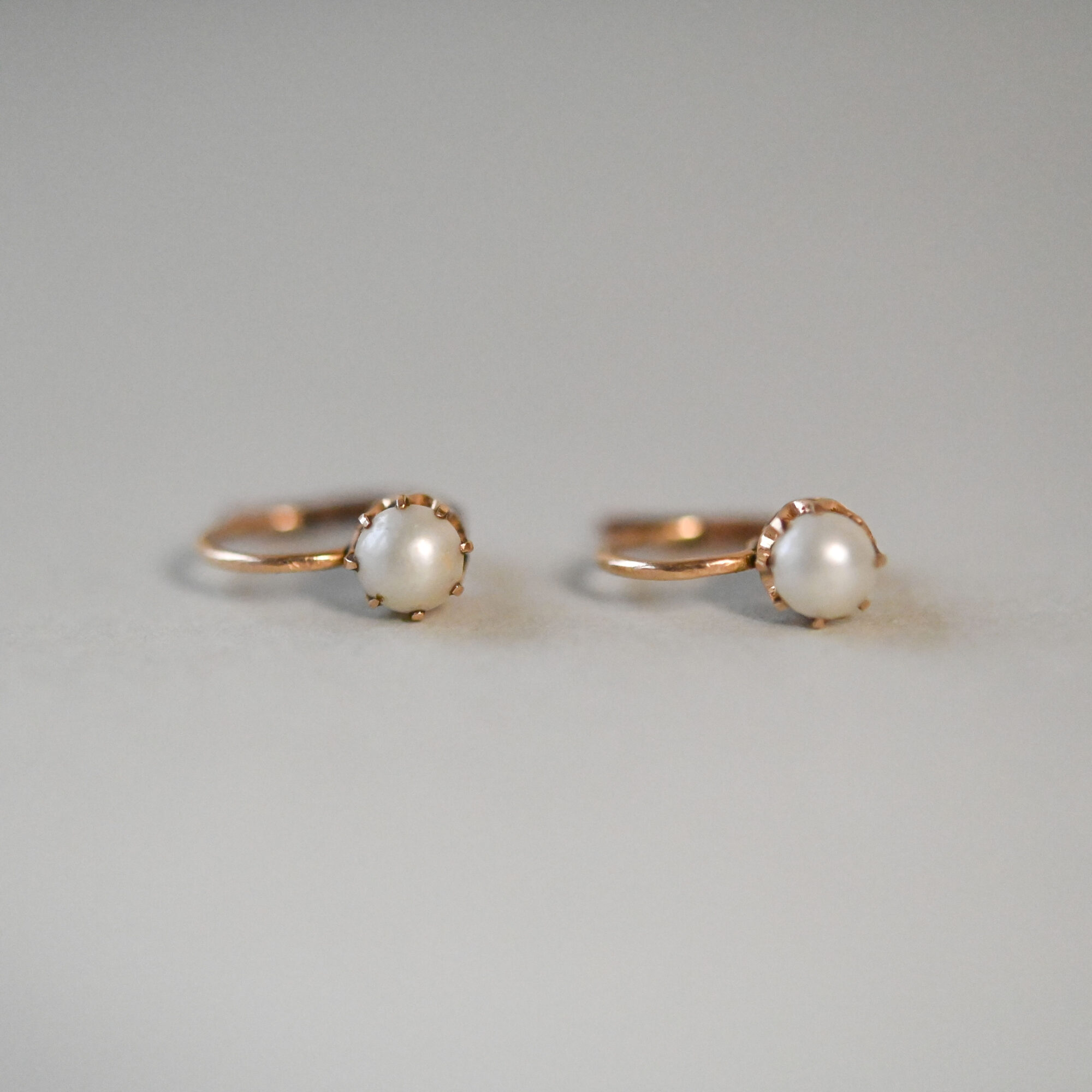 Pair of cutie antique 14ct gold half pearl earrings, c.1920s