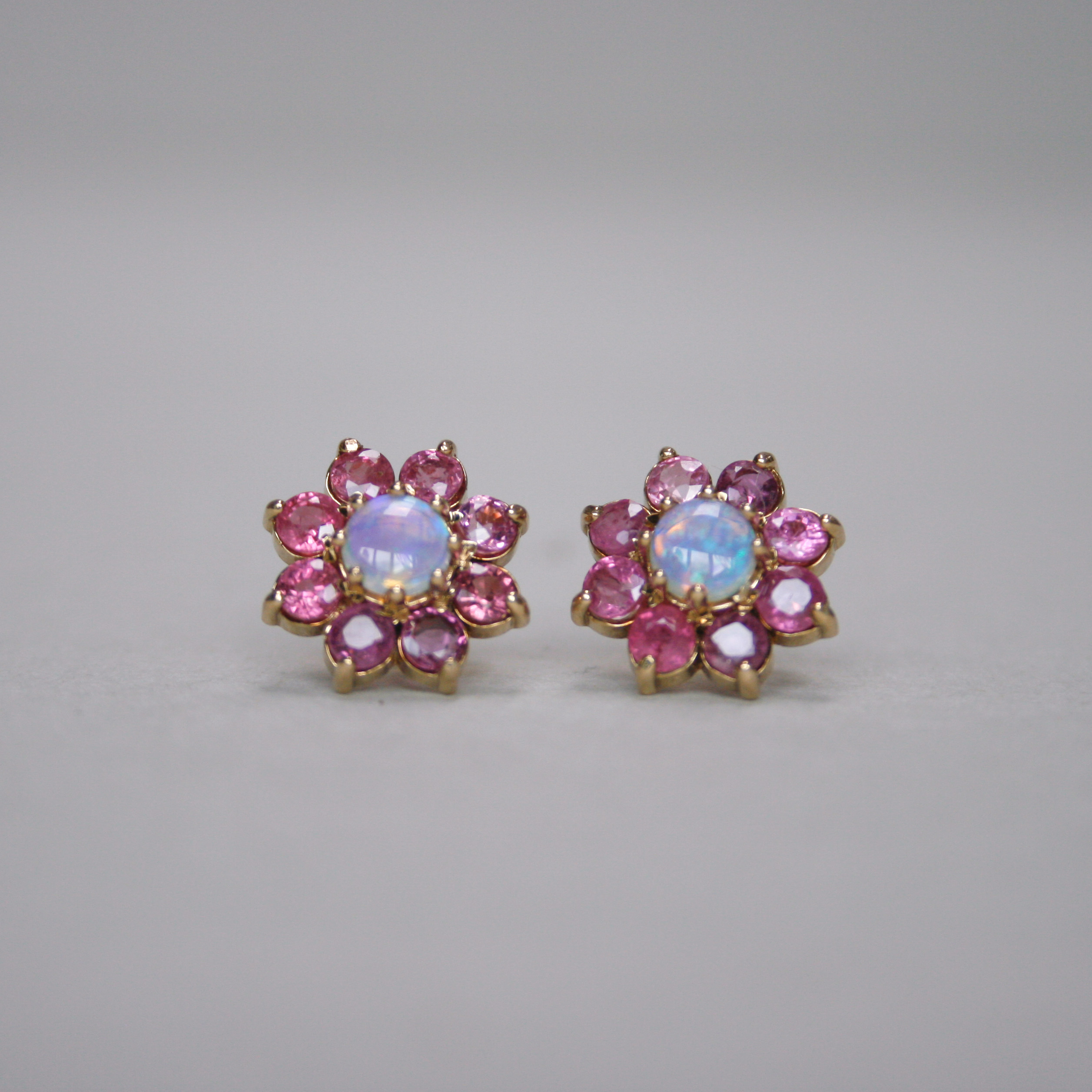 Contemporary pair of 9ct gold ruby and opal cluster earrings