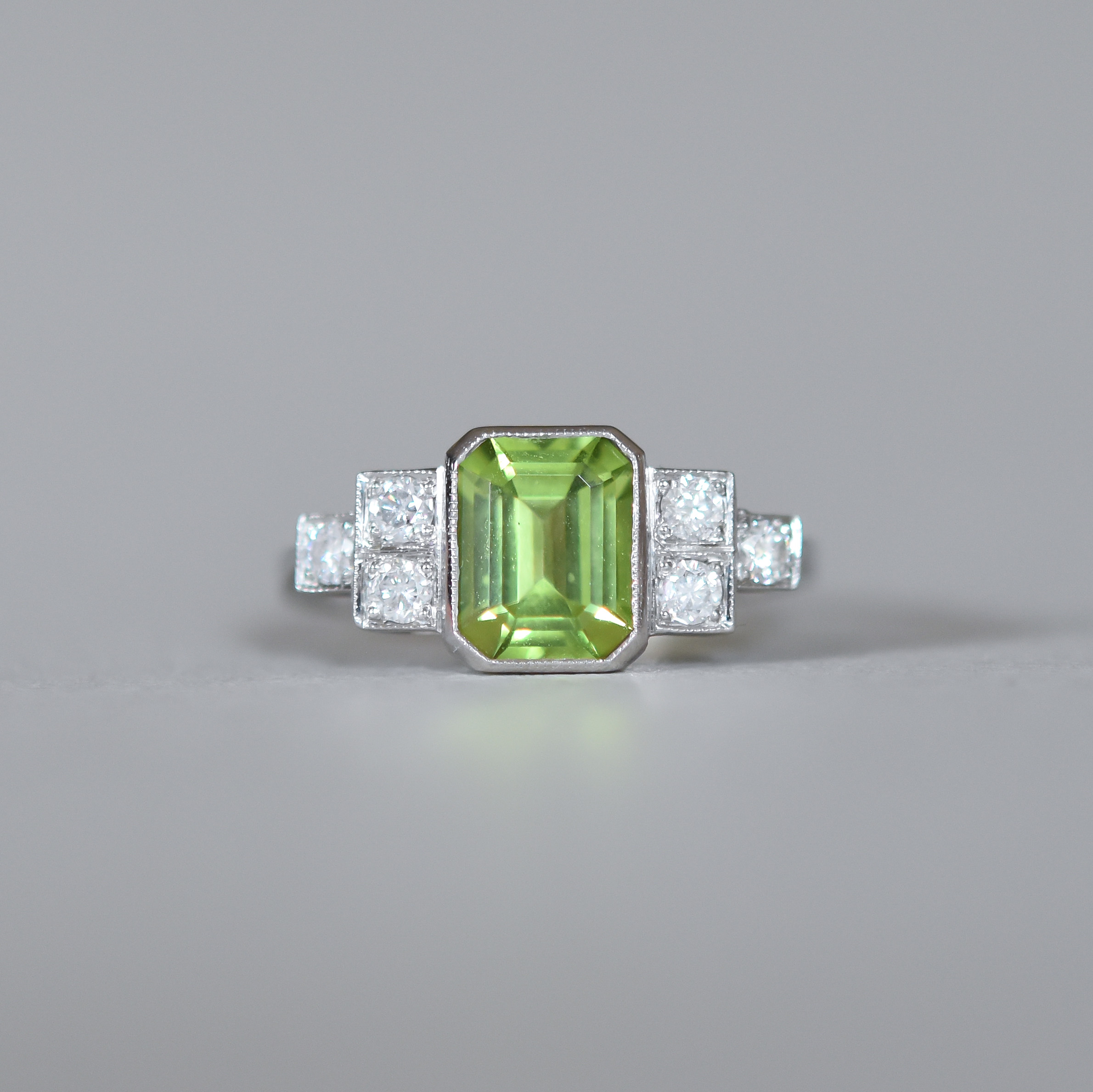 Contemporary Art Deco design peridot and diamond platinum ring