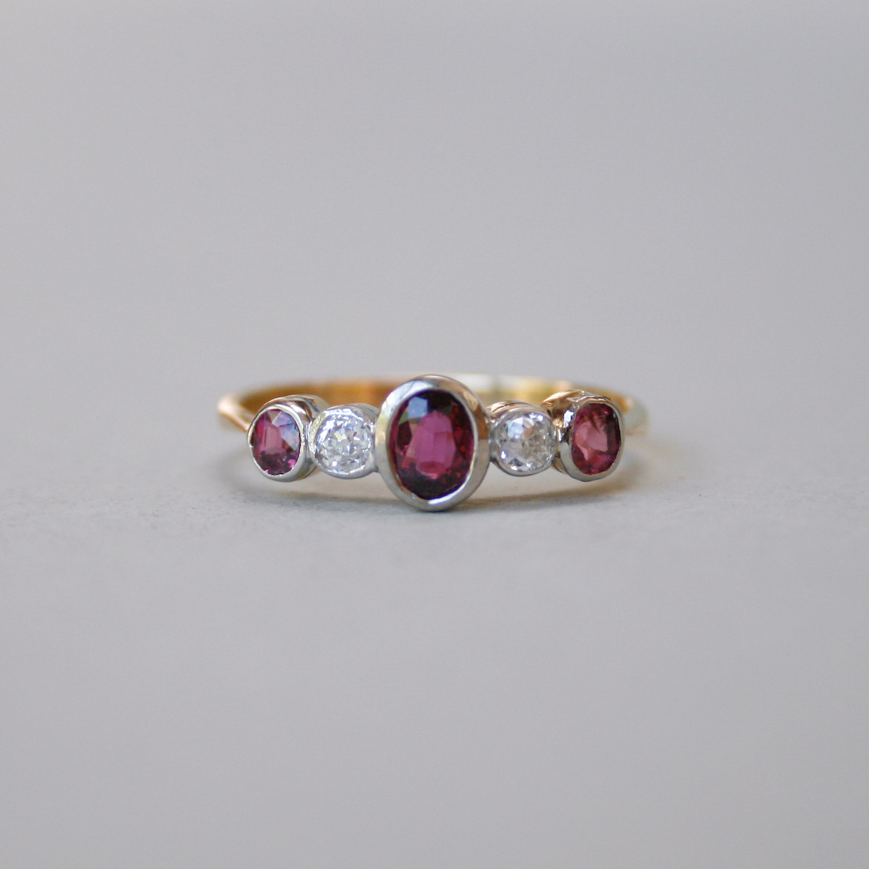 Edwardian 18ct gold ruby and diamond five stone ring, c.1910