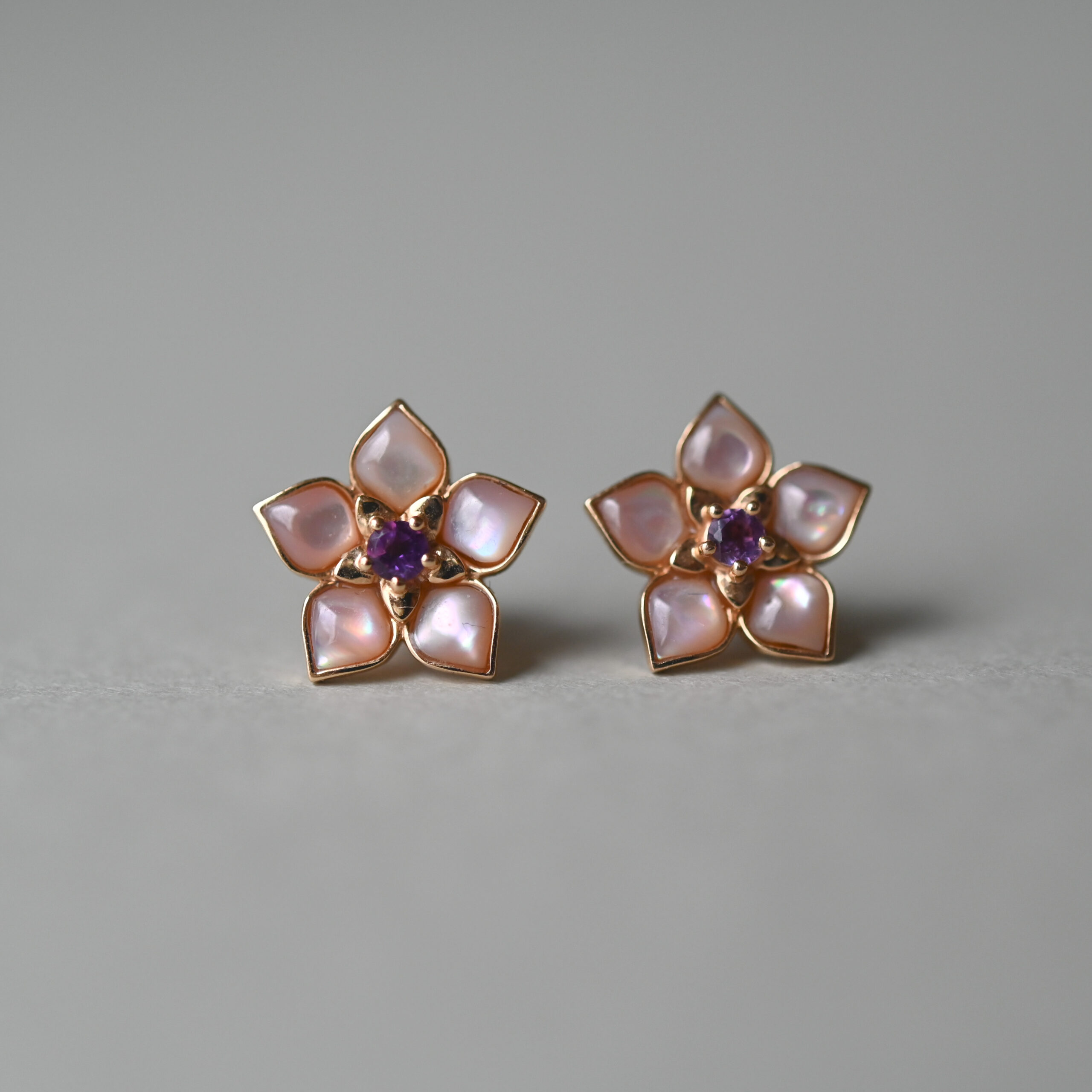 Aesthetic pair of 18ct gold mother of pearl and amethyst floral earrings