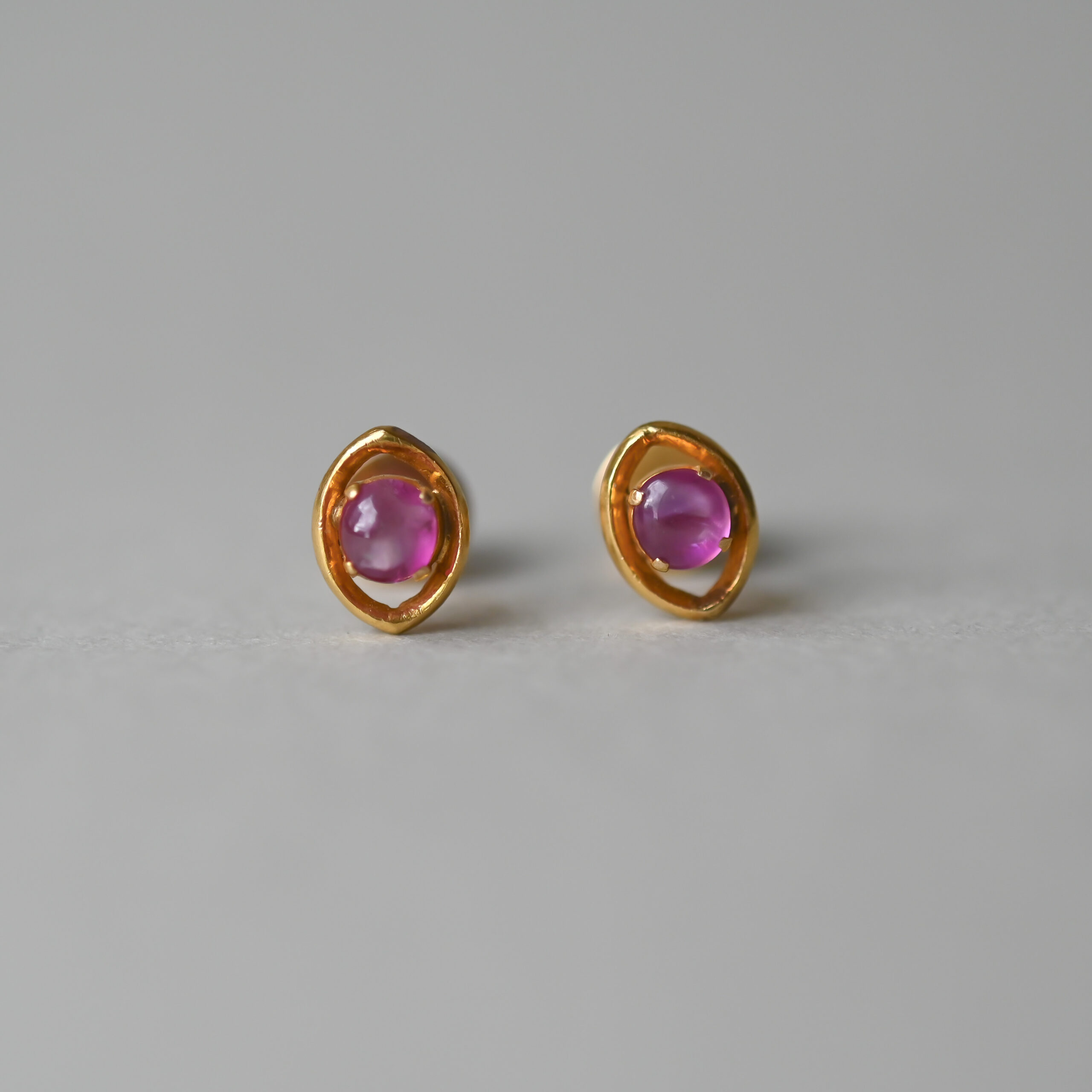 Contemporary pair of 18ct gold ruby cabochon earrings