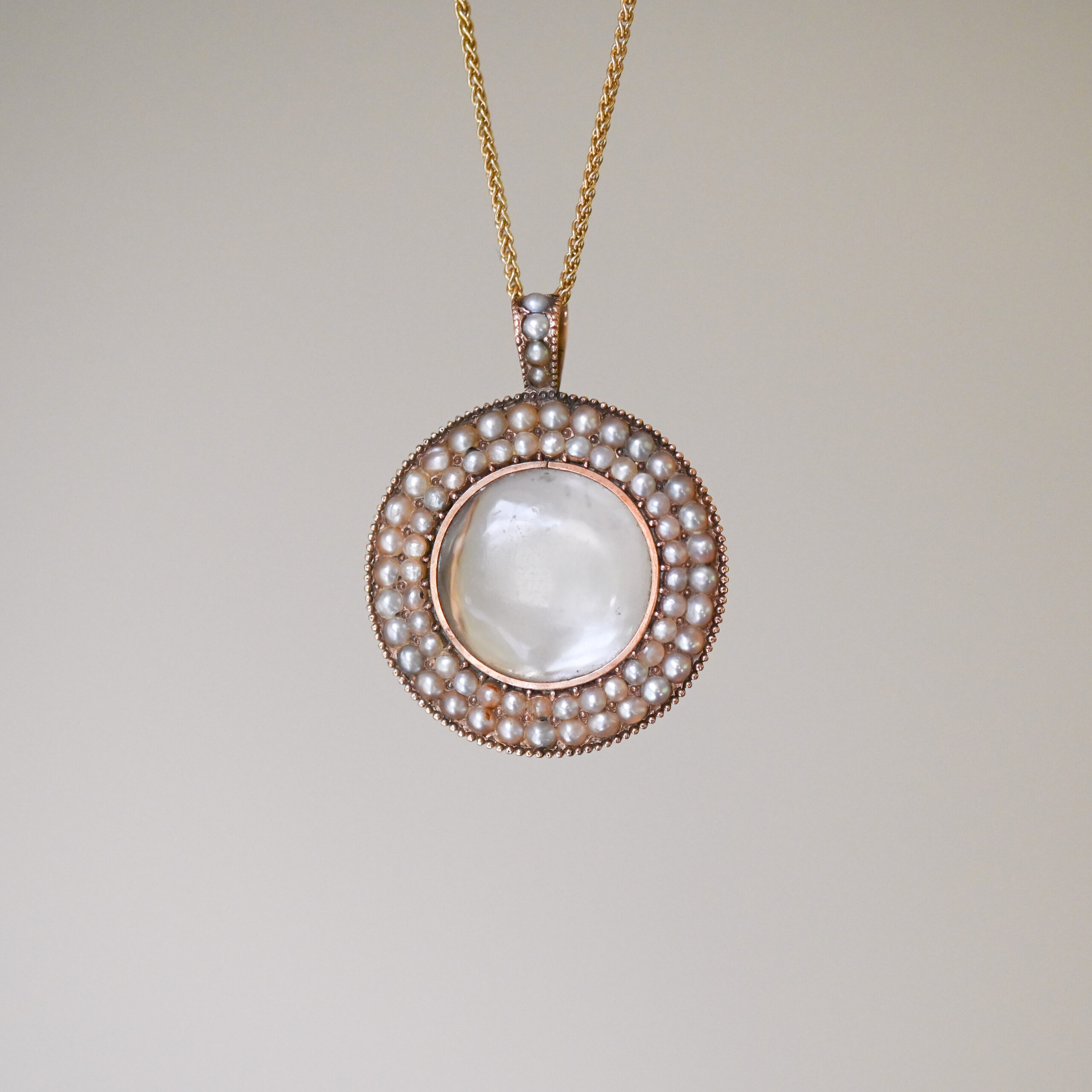 Georgian 9ct rose gold seed pearl glazed locket pendant c.1820s