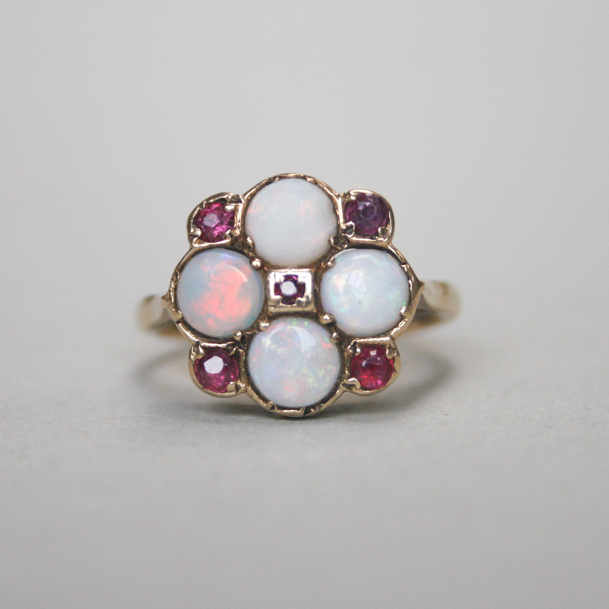 SOLD *Contemporary 9ct gold opal and ruby quatrefoil ring*