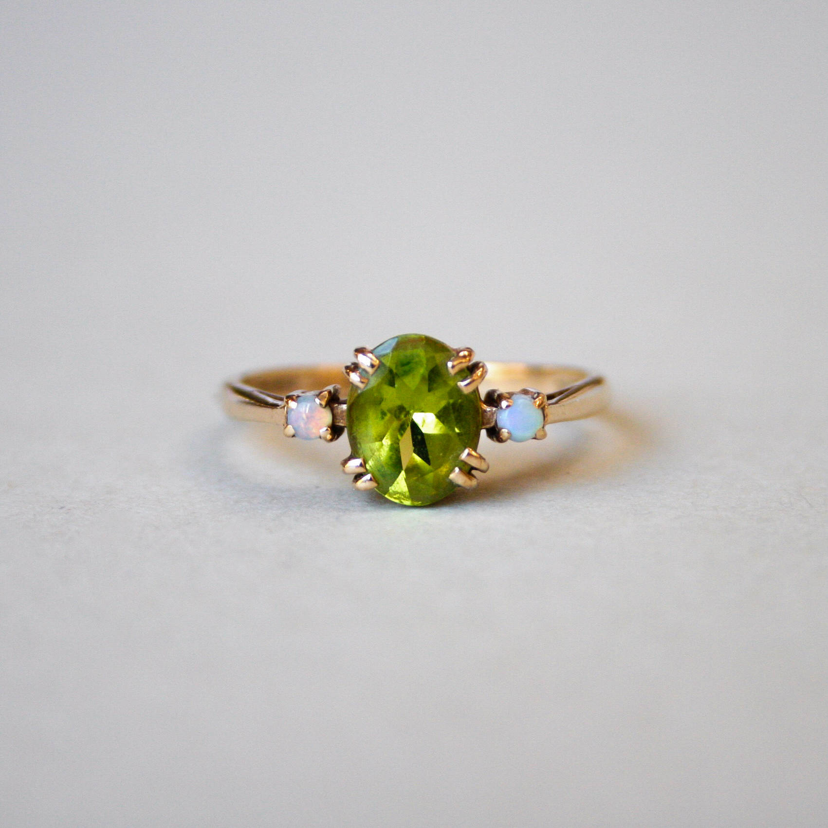 Contemporary 9ct gold peridot and opal ring