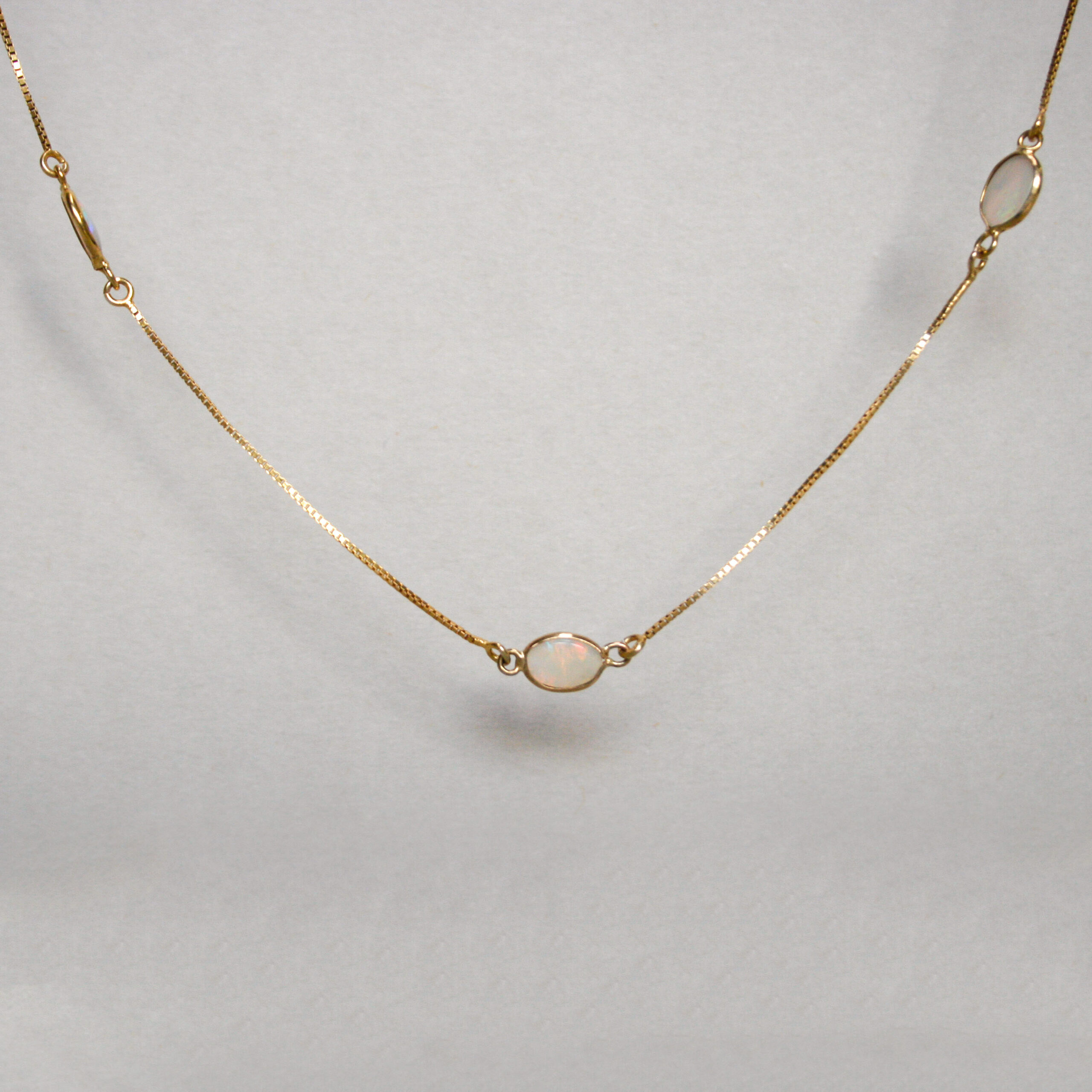 Dainty 9ct opal spectacle set station necklace