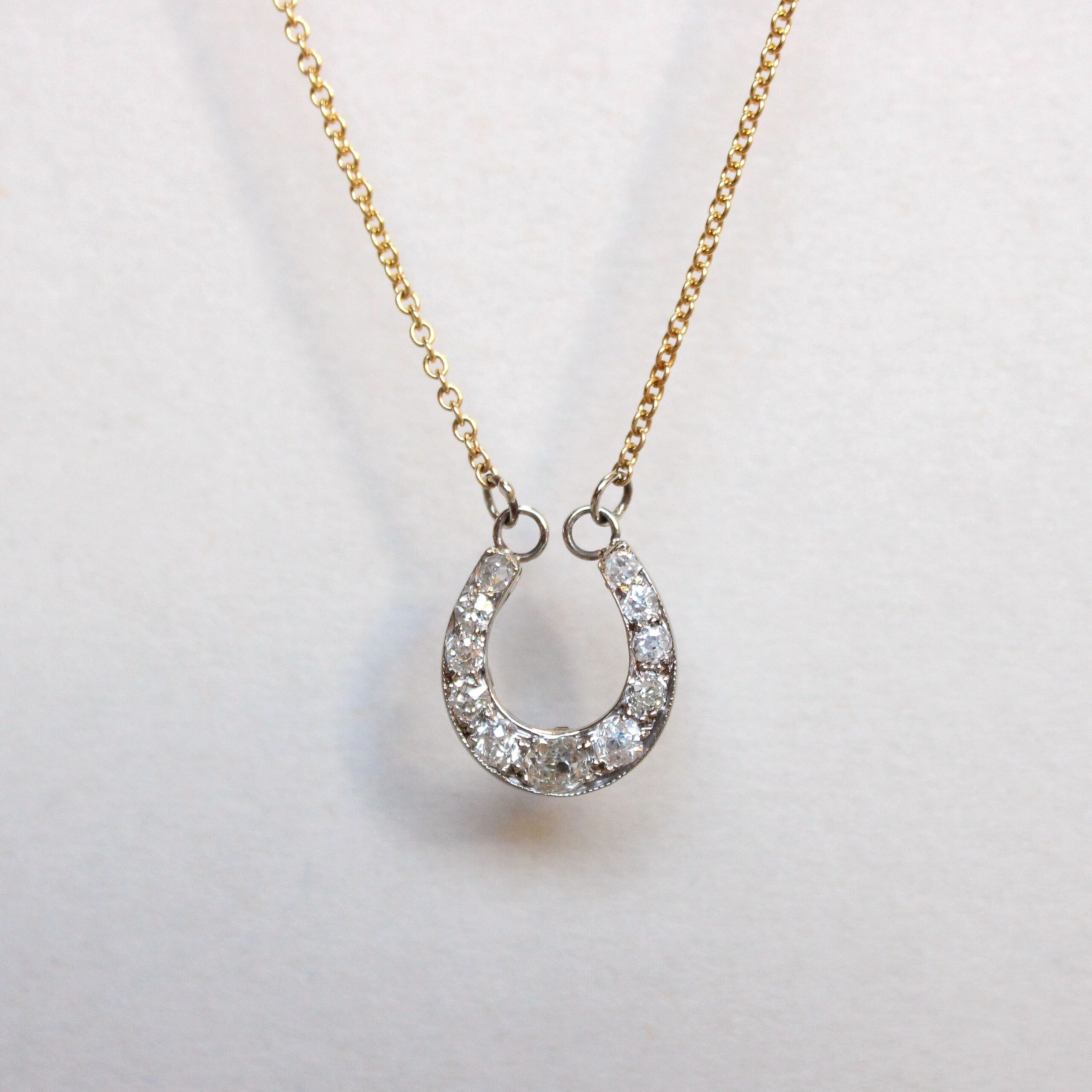 Victorian high carat gold diamond horseshoe conversion necklace, c.1900