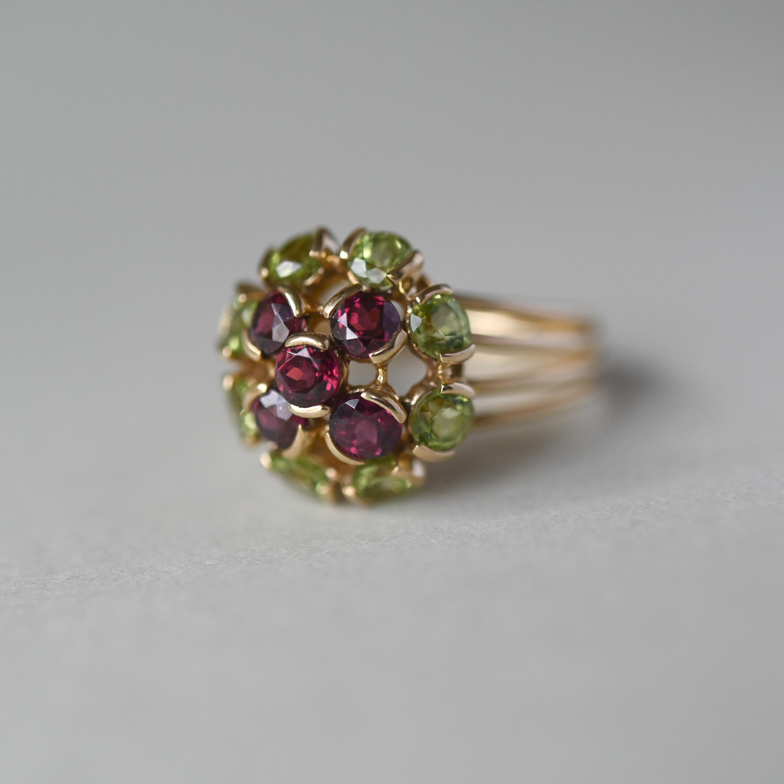 Contemporary 9ct gold peridot and garnet floral cluster ring - Image 2