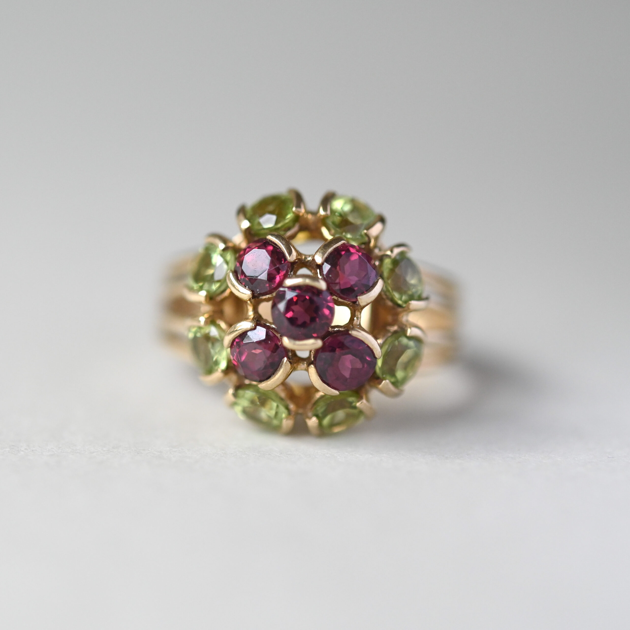 Contemporary 9ct gold peridot and garnet floral cluster ring