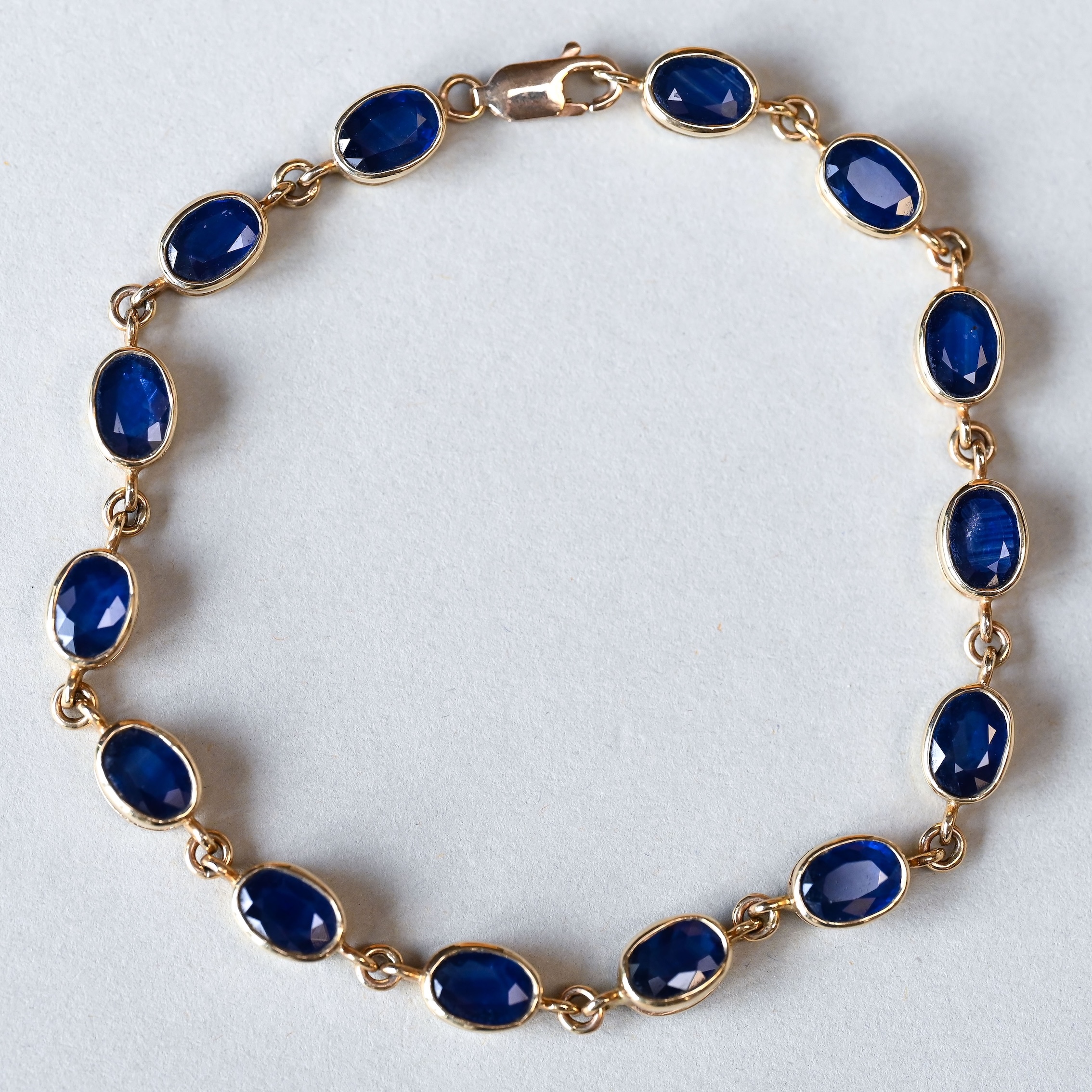 Contemporary 9ct gold sapphire tennis bracelet