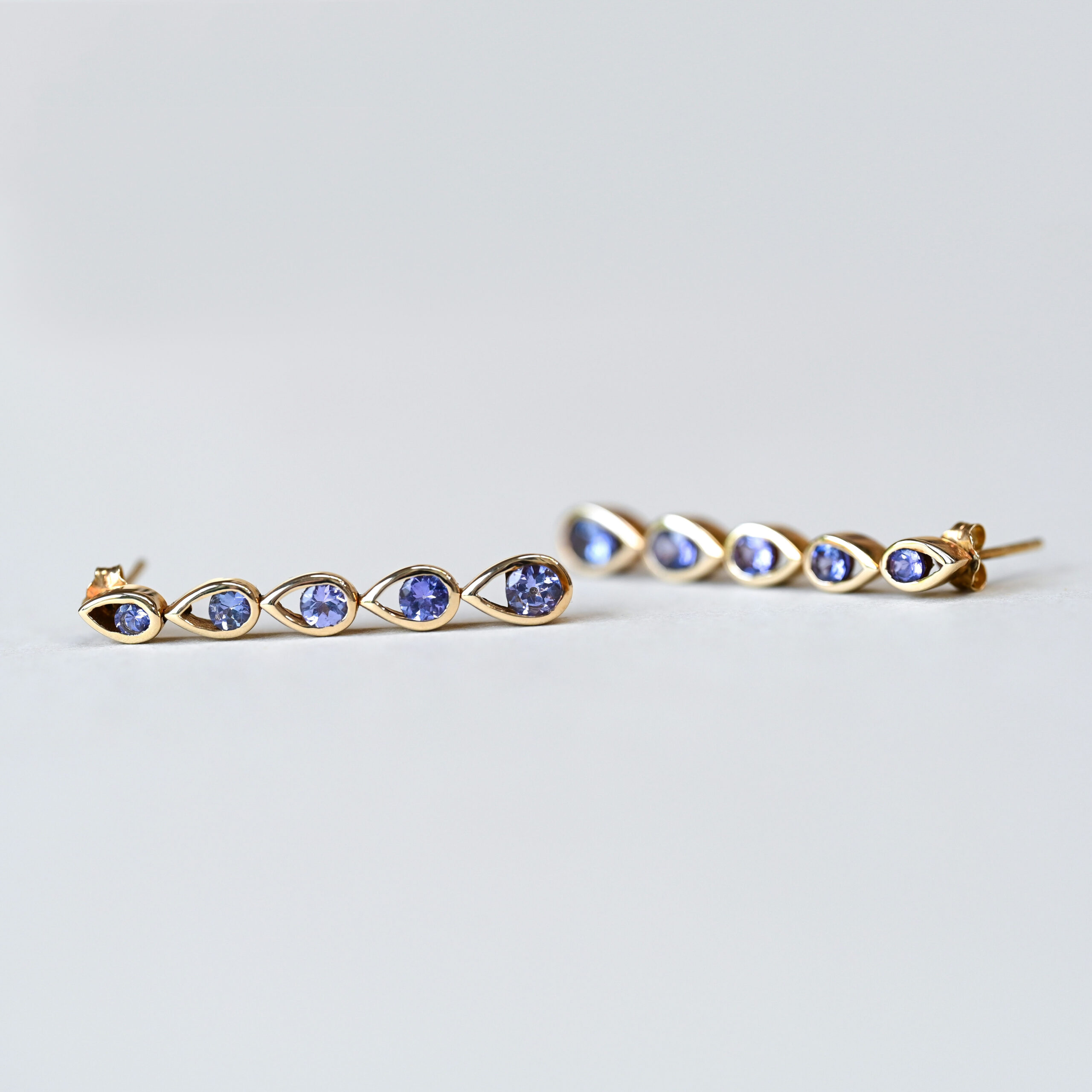 Contemporary pair of 9ct gold tanzanite drop earrings